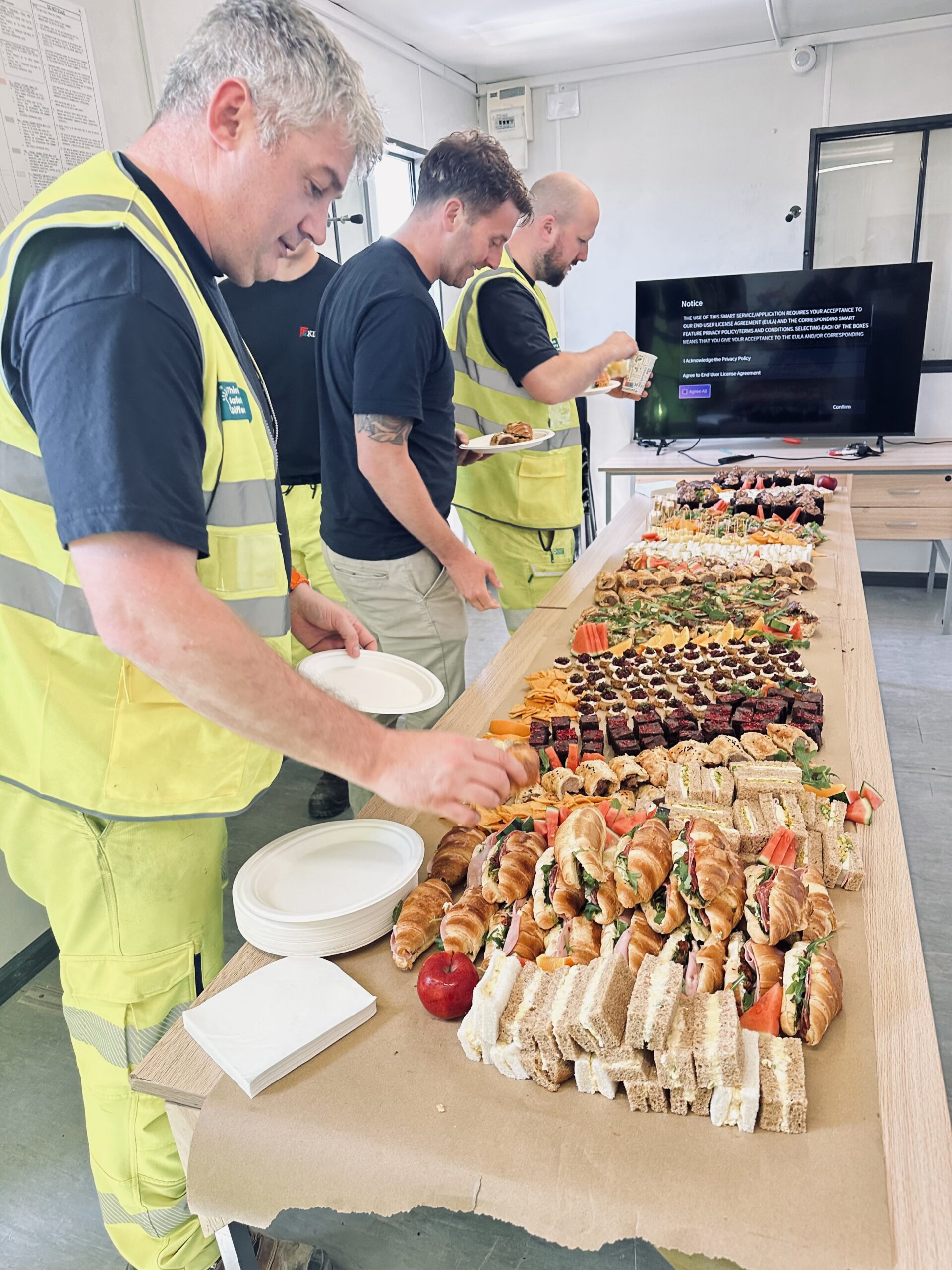 Construction workers enjoying Truly Scrumptious workplace catering in East Sussex